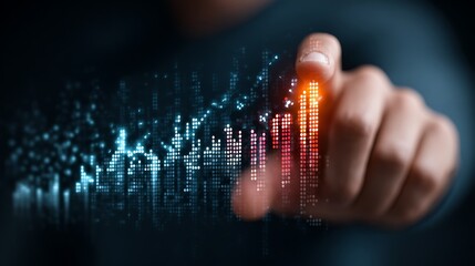Hand touching glowing digital financial graph with growing data