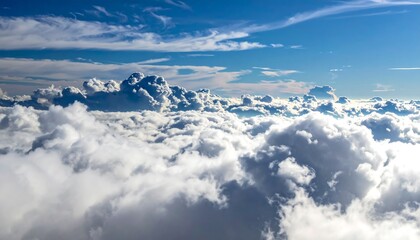 Naklejka premium High-angle view of a thick layer of white and gray clouds under a blue sky