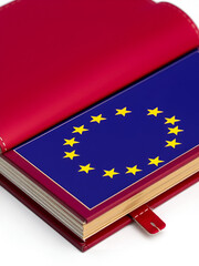 Burgundy book in which lies the flag of the European Union
