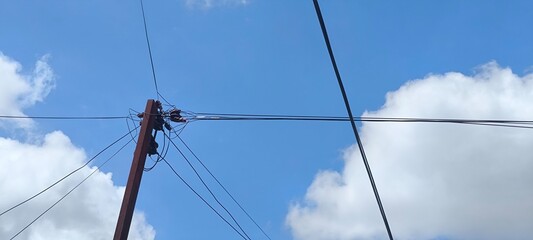 Fototapeta premium Electric poles and blue sky
