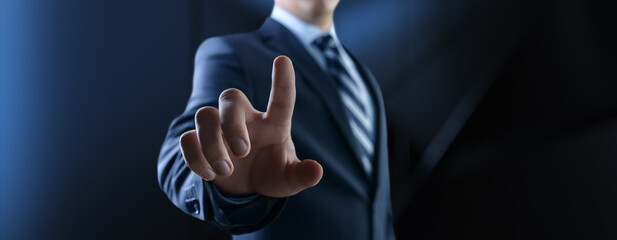 Businessman pressing button on virtual screen, Innovation and Digital Touch Interaction on Futuristic Technology Interface.