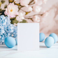 Blank mock up card in a festive arrangement with colored Easter eggs and spring flowers