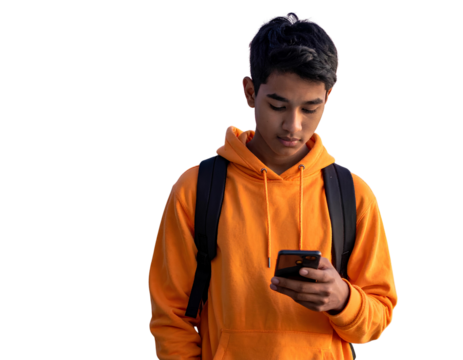 Teen Central Asian boy in orange sweatshirt using smartphone 