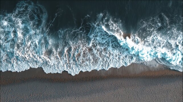 Aerial top view of ocean wave breaking on dark sand beach. Nature background with sea foam and shoreline for travel and summer concept. - Powered by Adobe