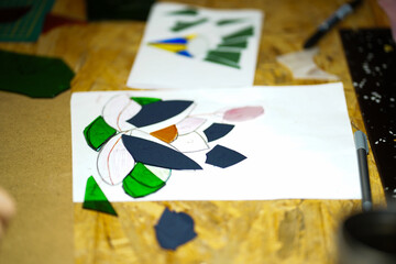 Making stained glass during artistic workshop. 