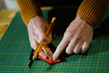 Making stained glass during artistic workshop. 