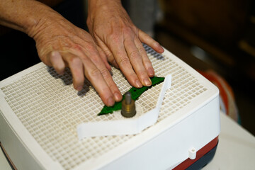 Making stained glass during artistic workshop. 