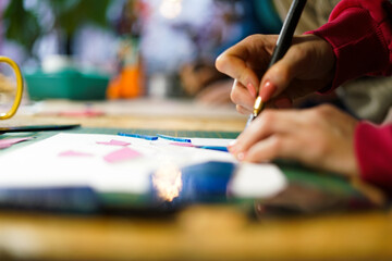 Making stained glass during artistic workshop. 