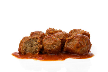 Fish meatballs in tomato sauce isolated on white background.