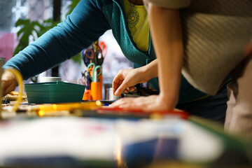 Making stained glass during artistic workshop. 