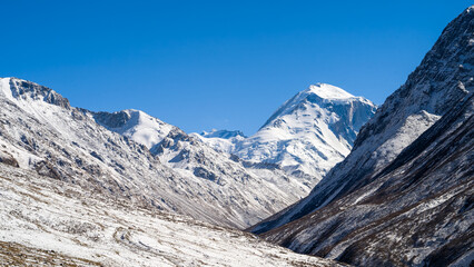 snow-capped mountain peaks. highlands, cliffs