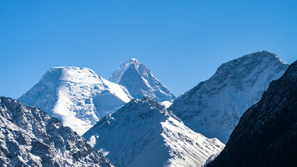 snow-capped mountain peaks. highlands, cliffs