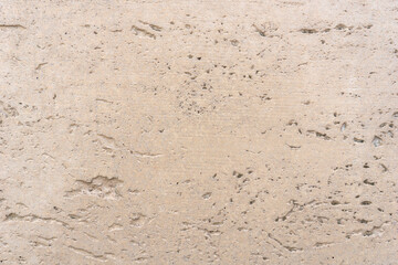 light beige natural travertine stone texture with subtle horizontal lines and porous surface, concept of architecture, luxury material, interior design