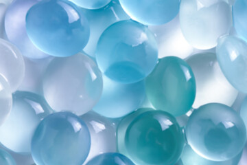 Wet blue stones out of focus, backdrop.