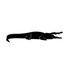Fototapeta premium Striking black silhouette of a crocodile with its mouth wide open, showcasing its powerful jaws and sharp teeth.