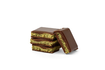 Pile of Dubai chocolate bar with with pistachio isolated on white background.
