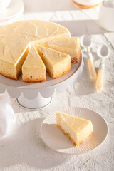 Sweet New york cheesecake served on white stone table.