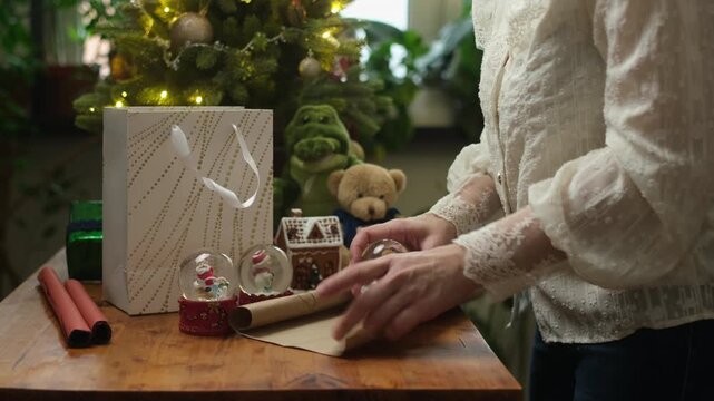 Person collecting Christmas presents in gift bag. Concept of giving gifts for Christmas or donating gifts for children