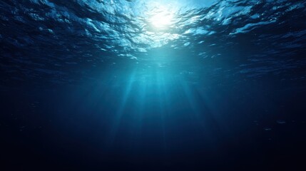 Tranquil Underwater Scene with Rays of Light Illuminating Deep Blue Ocean Water Surface for Nature and Marine Life Themes