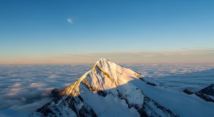 Stunning aerial view of snowy mountain peak above clouds with a crescent moon
