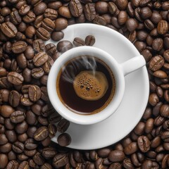 Hot coffee in a white cup surrounded by roasted coffee beans from a top down view