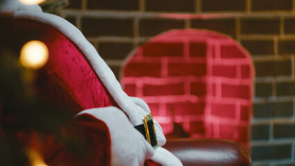 Santa Claus Adjusts His Seat Belt While Sitting on the Sofa Before Going Sleep