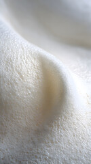 Creamy Texture: A close-up shot of a creamy, textured surface, the image evokes a sense of smooth delicacy and subtle movement.
