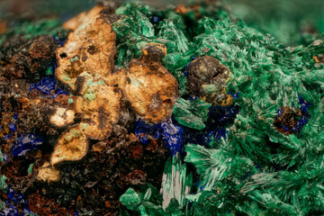 Kamenushinskoe copper minerals microphoto — professional macro and micro mineral photography. Diverse crystal forms: acicular azurite, radiating malachite, botryoidal limonite, granular chalcopyrite