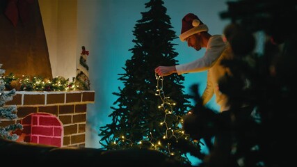 Man Decorates Christmas Tree While Dancing with White LED Lights - Powered by Adobe