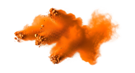 Isolated orange powder explosion with particles against a stark black background in a studio shot