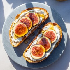 Toasted bread with creamy cheese spread, fresh fig slices and golden honey drizzle.