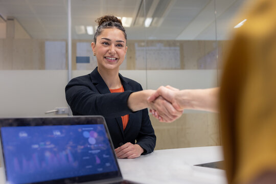 Graduate shaking hands in an interview