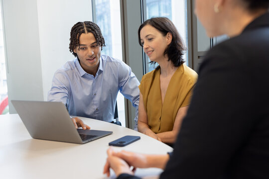 Young businessman introducing artificial intelligence for office productivity