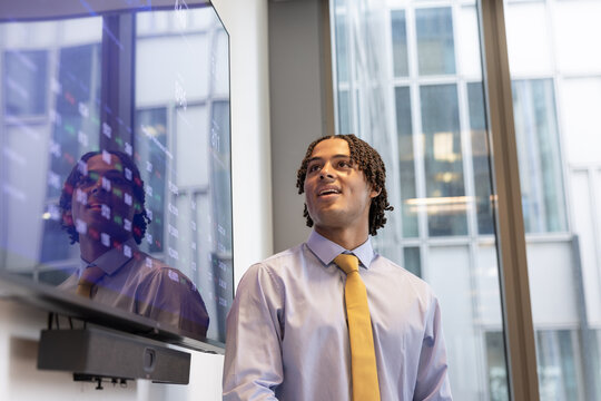 Young Professional Presenting in a Modern Office