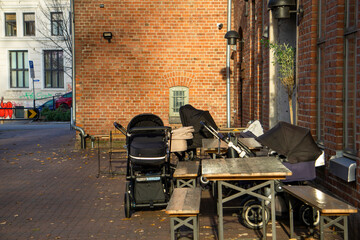 Babies Sleeping in Strollers Outdoors During Winter in Oslo, Peaceful Nordic Parenting and Cold Weather Lifestyle Concept