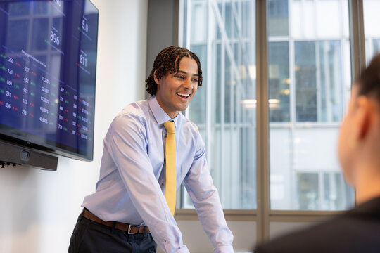 Happy new trainee giving his first business presentation