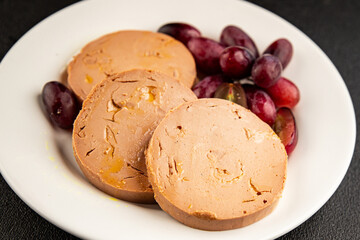 Foie gras pate goose liver delicacy tasty snack fresh delicious gourmet food background on the table rustic top view copy space