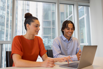 New employees working in a corporate office together