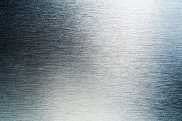 Brushed metal texture with fine horizontal scratches and subtle light reflections