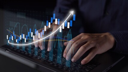 A close-up view of hands typing on a laptop keyboard, featuring an overlay of a rising growth graph, symbolizing data analysis and modern finance in business. Copula