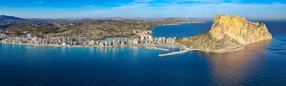Aerial View of Calp, Spain and the Extensive Condos, Villas, and Prime Real Estate by the Majestic Pe&ntilde;&oacute;n de Ifach on the Mediterranean Coast