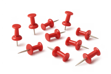 Red pushpins scattered, securing notes, organizing office documents, marking important locations on a map