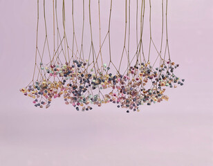 Hanging Multicolor Dried Flowers on Soft Pink Background
