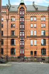 Close-up of a detailed historic brick facade and bicycle in Hamburg's port area