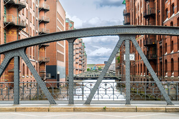 A wooden bridge framed by historic German buildings