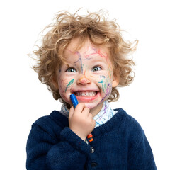 A joyful toddler with a crayon covered face laughs while holding a marker against a white background