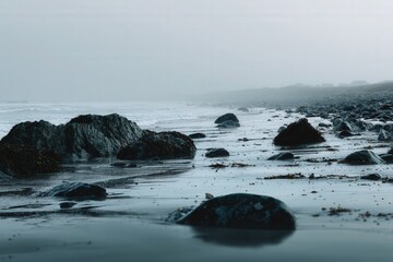Stunning view of the misty West of Ireland coast with rocky shoreline at dawn