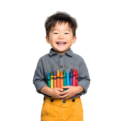 A happy young Asian child smiling joyfully while holding a bunch of colorful crayons against a white background