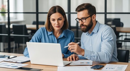 Professional colleagues collaborating using a laptop in a modern office setting discussing
