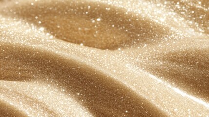 Naklejka premium Shimmering golden sand texture with sparkling particles creating a mesmerizing surface of beauty in a natural environment with soft waves